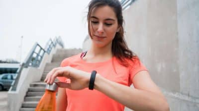 fitness-woman-checking-time-on-smart-watch-V7RVRR6